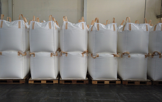 Stacking of bulk cargo in jumbo bags are store in warehouse